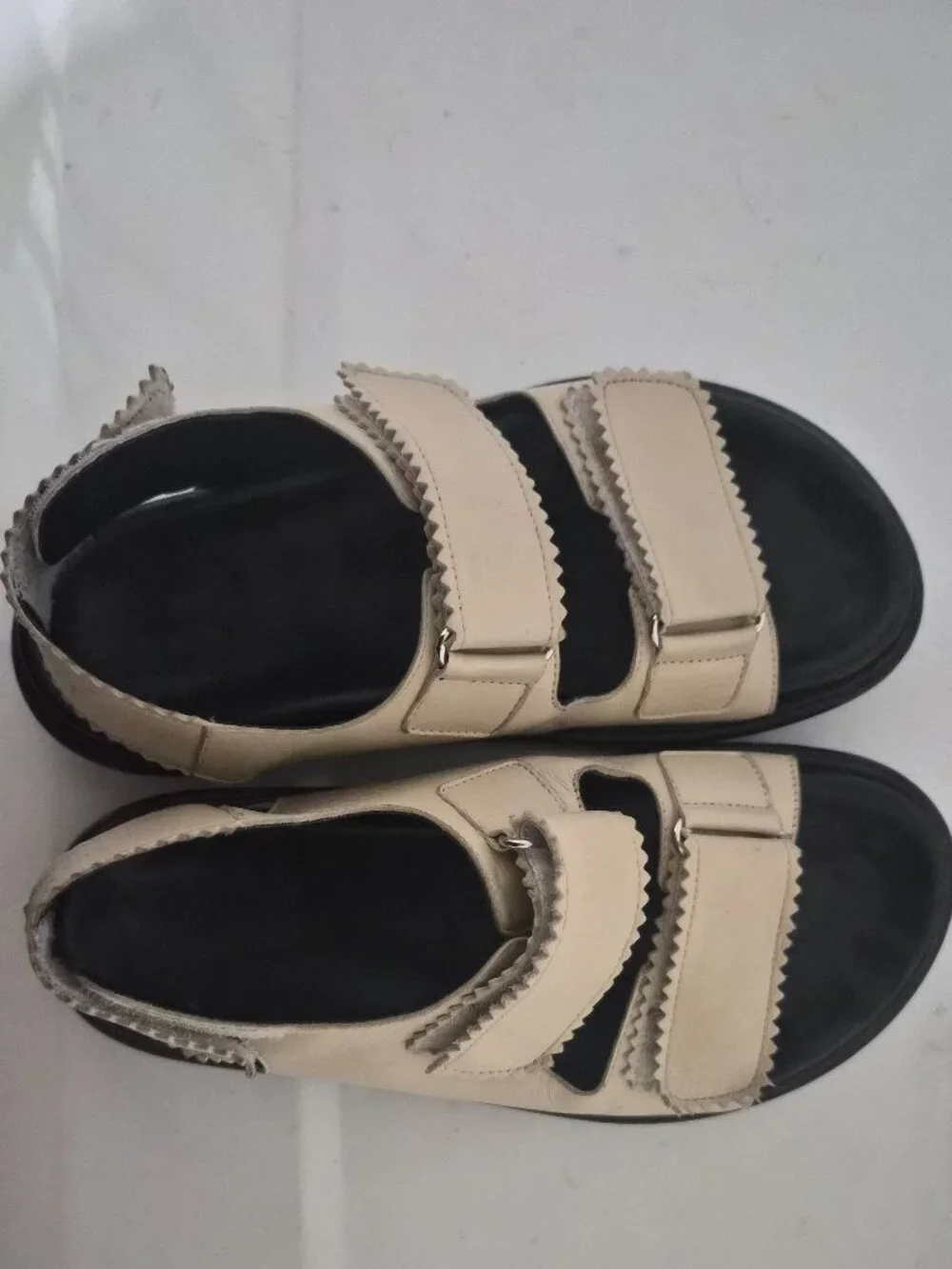 Maguire Cream and Black Minimalist Sandals with Two-Strap Design